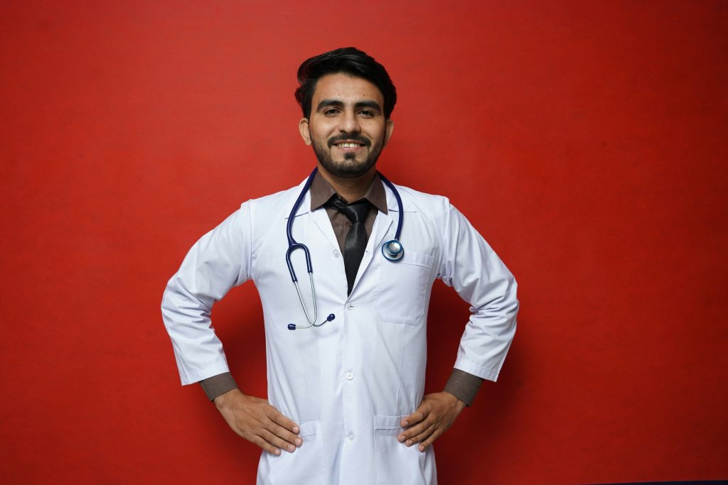 Man in white shirt standing upright